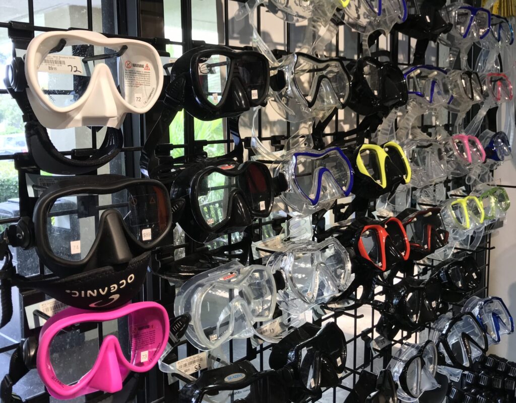 A display of scuba diving masks in a dive shop