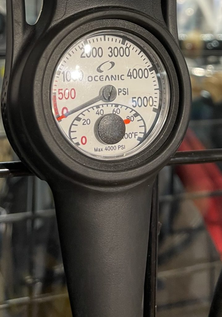 A submersible pressure gauge that connects to a first stage scuba regulator